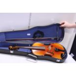 A cased electric violin