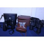 Two pairs of binoculars and a vintage Kodak camera