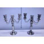 A pair of silver plate on copper candelabra's