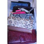 A job lot of ladies purses and handbags etc