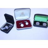 Two pairs of sterling silver cufflinks and a Viking themed tie pin