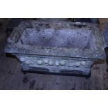 A oblong stone trough planter with stand, postage unavailable
