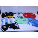 A selection of assorted sports shirts mixed sizes