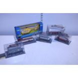 Five boxed die-cast bus models and one other