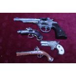 A selection of novelty miniature pistols etc