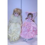 Two vintage bisque headed dolls