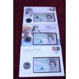 Three commemorative covers note and five pound coin sets
