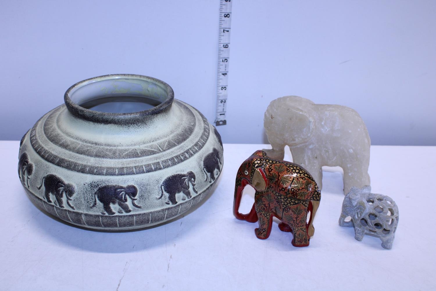 A selection of elephant themed collectables