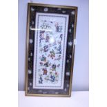 A framed Chinese silk work picture