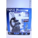 A boxed child's microscope set