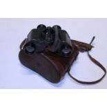 A pair of military binoculars by W Watson & sons with crows feet markings