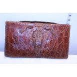 A vintage crocodile skin ladies bag