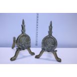 A pair of antique heavy brass fire dogs