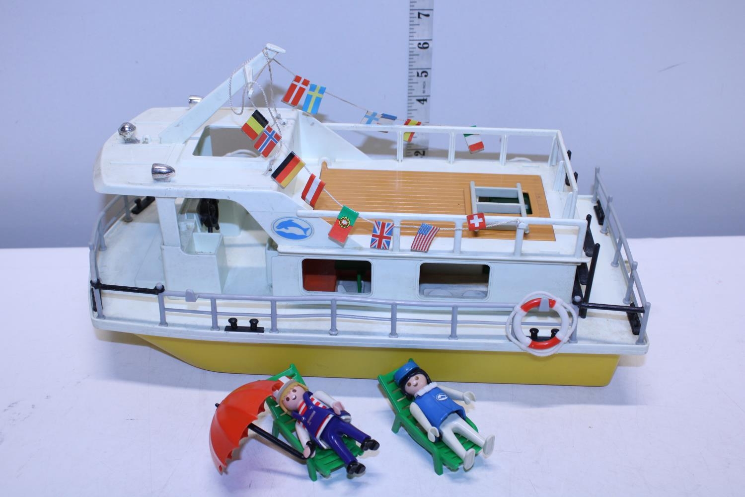 A Playmobil boat and figures