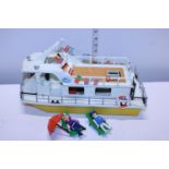 A Playmobil boat and figures