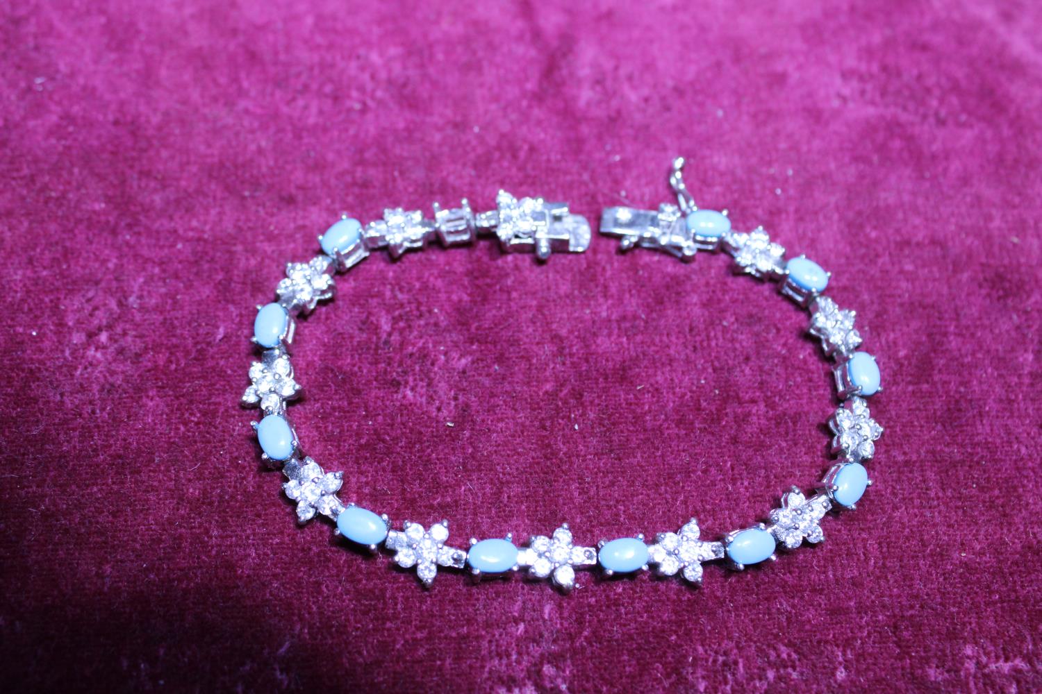 A 925 silver bracelet with blue stones