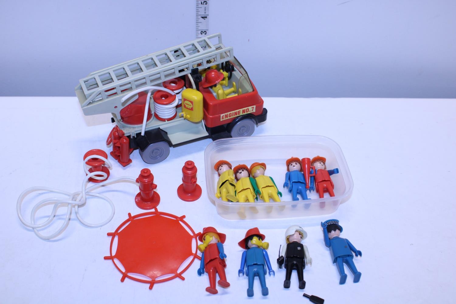 A vintage Playmobil figure engine and figures