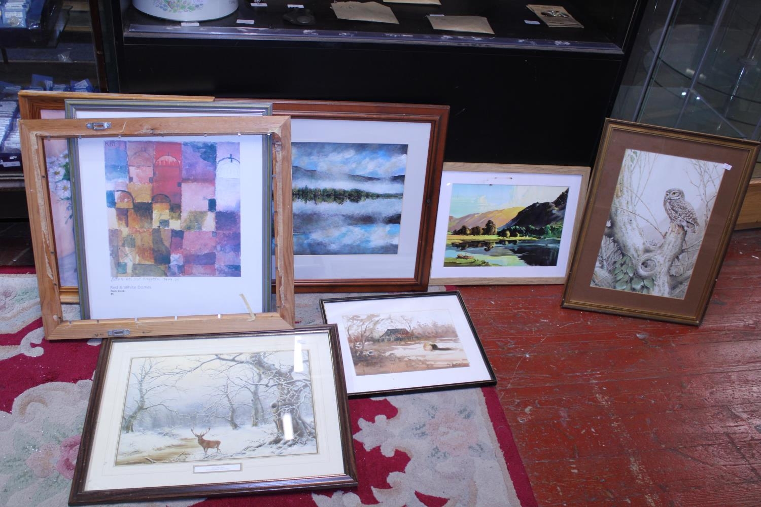 A selection of assorted framed artwork, shipping unavailable