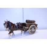 A ceramic shire horse and Draymon's wagon