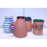 A selection of assorted ceramic jugs and wine cooler