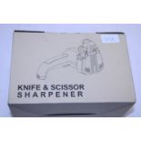 A boxed electric knife and scissor sharpener