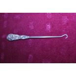 A hallmarked silver handled button hook