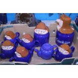 A selection of Tetley Tea folk teapots and storage jars