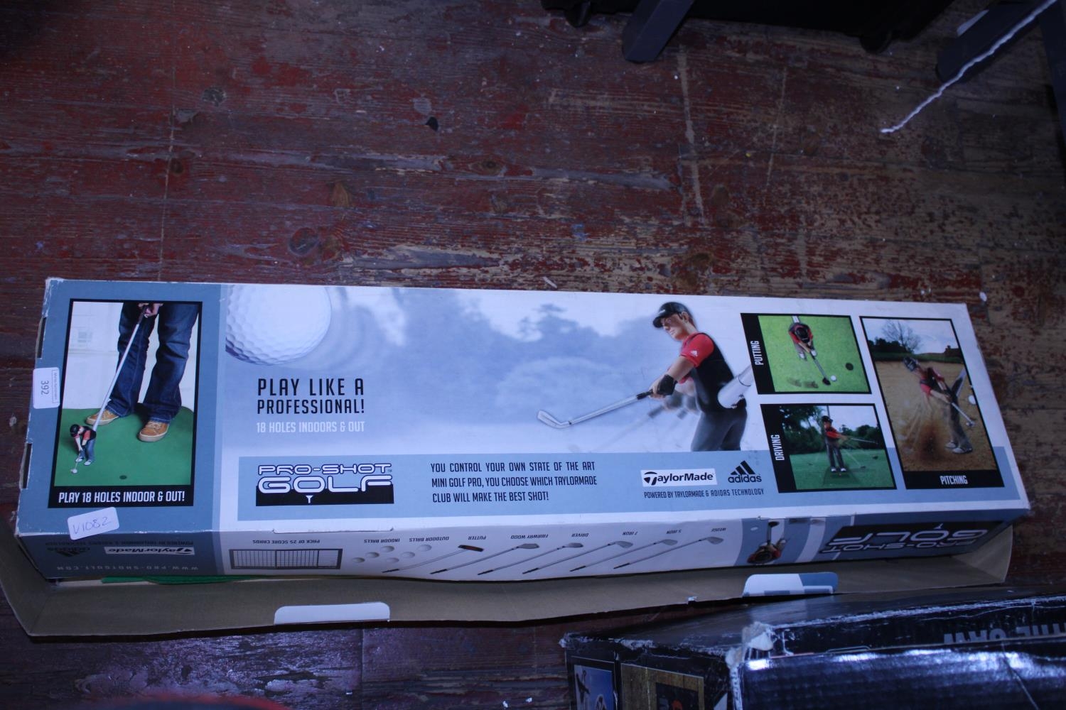 A boxed indoor golf game. Postage unavailable