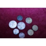 A small selection of coins including a silver florin