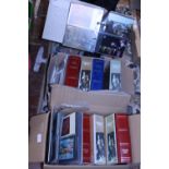 Two boxes of assorted postcard albums