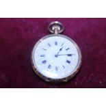 A ladies 18ct gold pocket watch finely engraved decoration to reverse and enamel dial