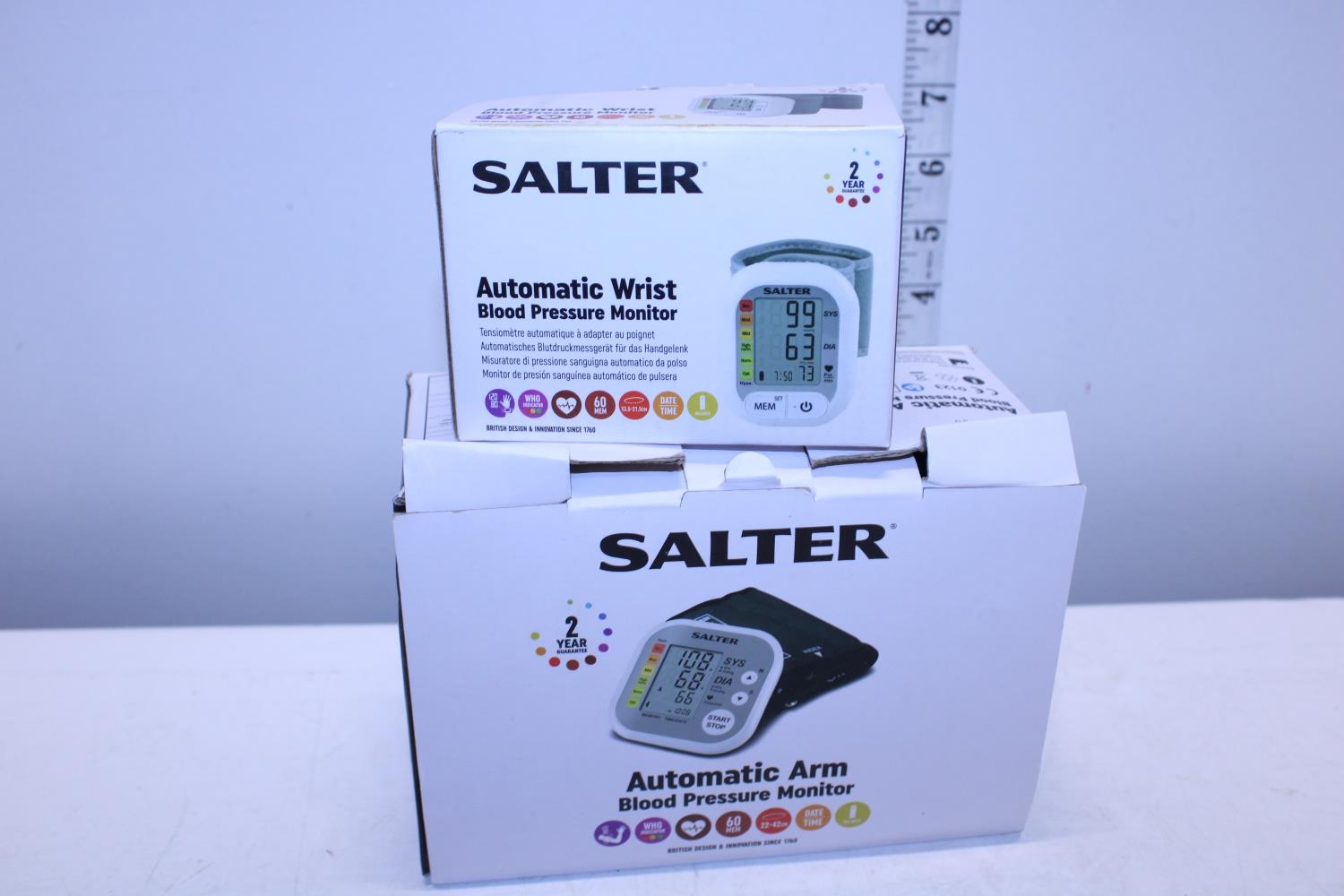 Two boxed Salter blood pressure monitors