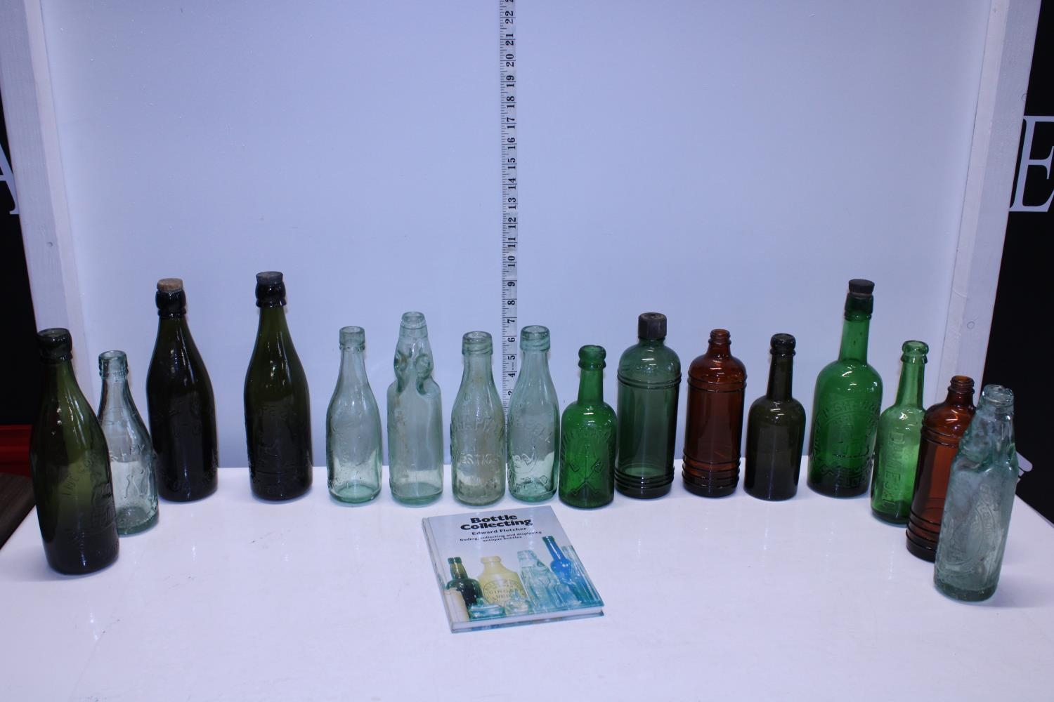 A selection of antique glass bottles. Postage unavailable