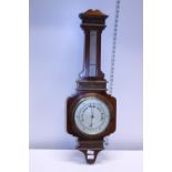 A antique mahogany cased Barometer by Aitchison of London 34". Postage unavailable
