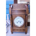A vintage Japy Freres wooden cased mantle clock with key working order (slight damage to dial)