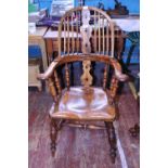 A antique over varnished rustic spindle back farmhouse chair 110cm tall. Postage unavailable