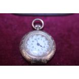 A beautiful ladies 14ct gold pocket watch very finely decorated with enamel to the reverse