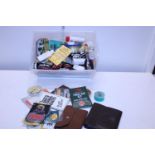 A box full of assorted fly fishing accessories including line, hooks, feeders etc