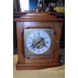 A vintage Kienzle wooden cased striking clock in GWO with key, shipping unavailable