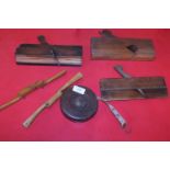 A selection of vintage woodworking tools including a Rathbone cased tap measure