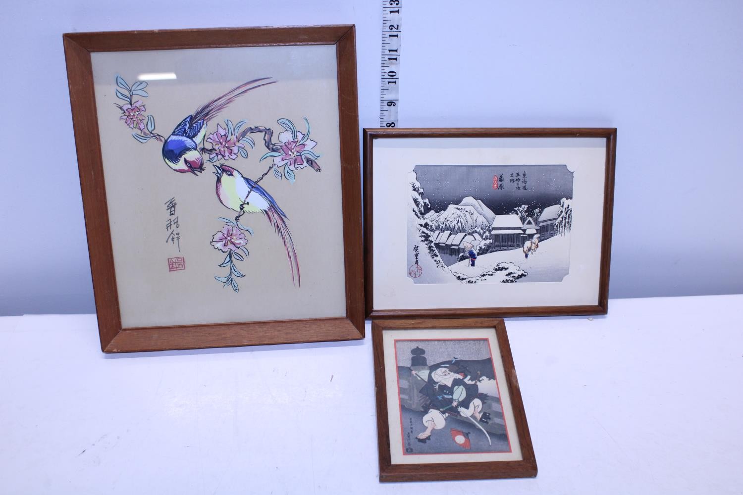 Three framed oriental pictures