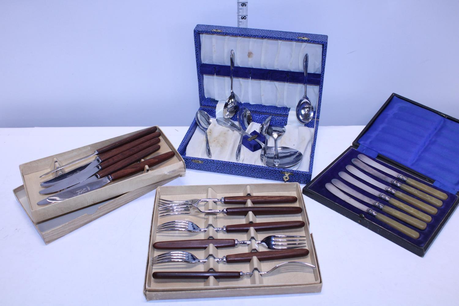 A selection of boxed vintage cutlery
