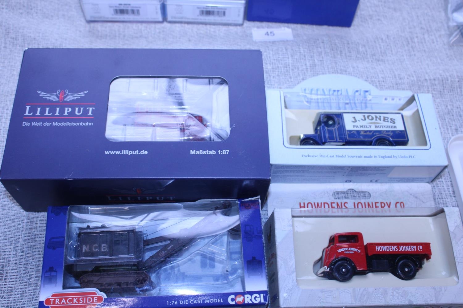 Four boxed assorted die-cast models
