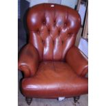 A Victorian style leather arm chair. Postage unavailable