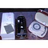A antique Jones manual sewing machine and a fidelity portable record player. Postage unavailable