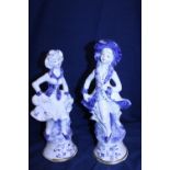 A pair of Capodimonte figurines. 35cm tall.