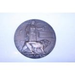 A WW1 bronze death penny awarded to Arthur Walker