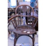 A well made antique wooden child's Windsor style armchair. Shipping unavailable