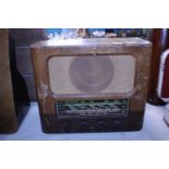 A vintage wooden cased radio. Postage unavailable