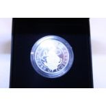 A boxed 1 ounce silver proof coin